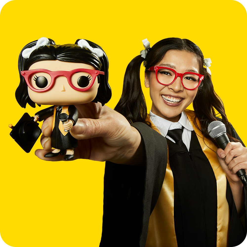 Yellow background with grad holding a custom Funko POP! Yourself vinyl figure