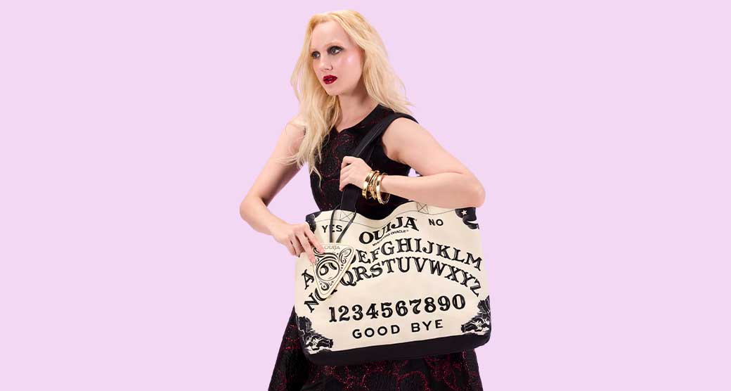 Model showcasing Loungefly Warner Brothers IT Crossbuddies Bag